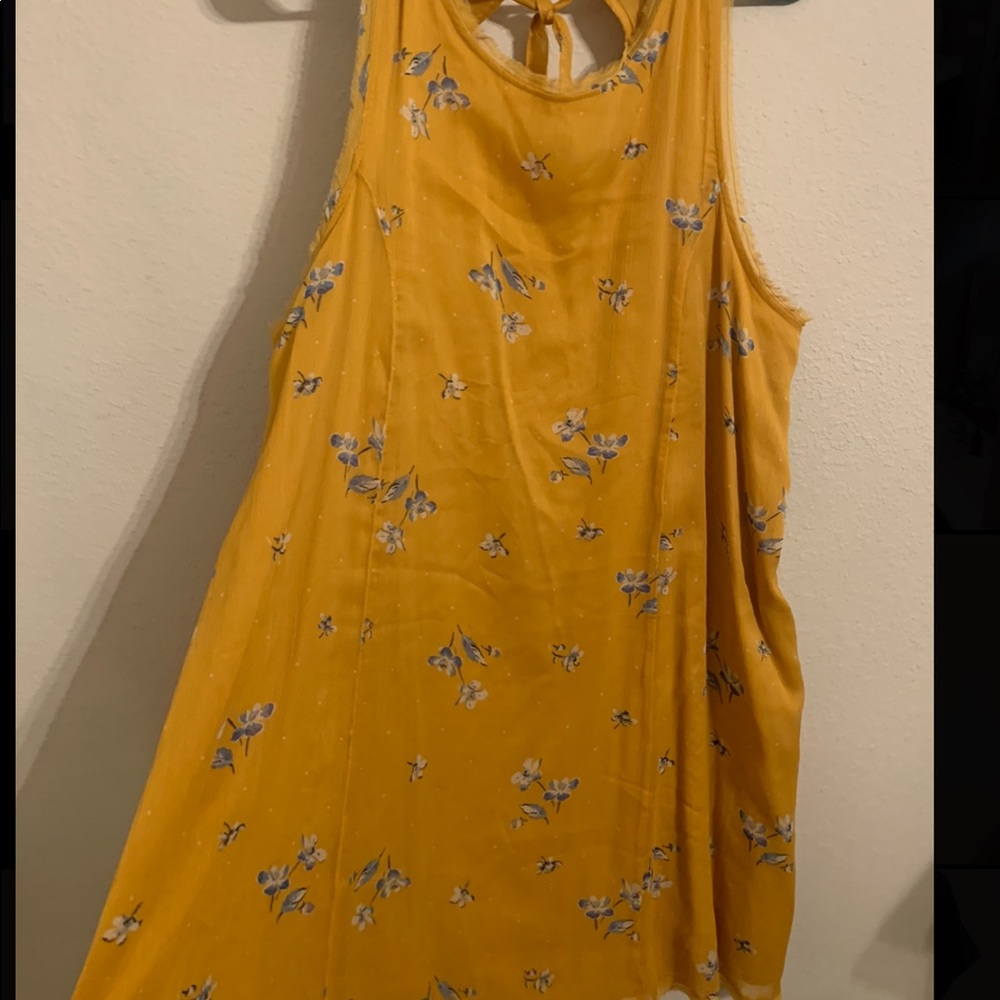 Mustard raw hem dress with blue flowers and tie neck closure